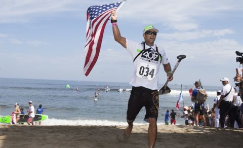 USA’s Danny Ching, crossing the finish line placing first and earning the Gold Medal in his ISA debut in the SUP Long Distance Race. Photo: ISA/Bielmann
