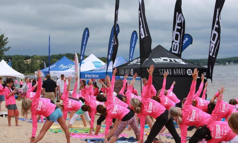 Participants take part in a yoga exercise at Standup for the Cure&#039;s 2016 Muskegon event.