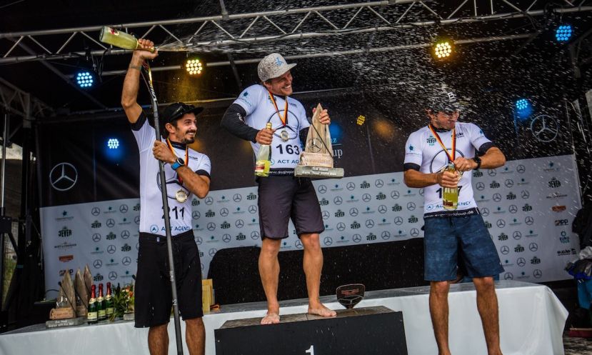 Michael Booth getting a champagne shower atop the podium in Germany. | Photo: Georgia Schofield