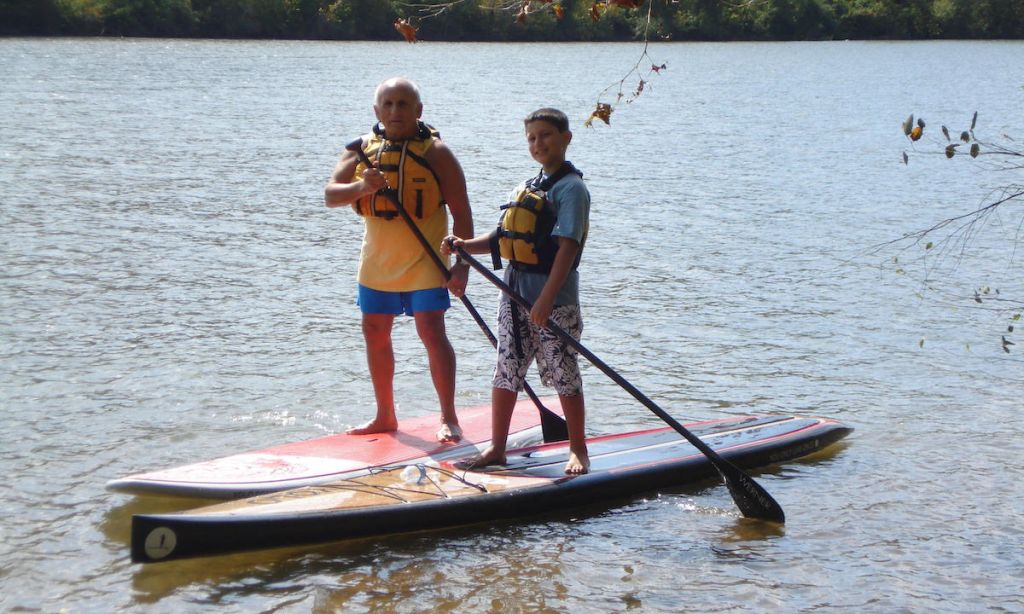 Jim Dreeben with his grandson on their SUPs. | Photo courtesy: Jim Dreeben