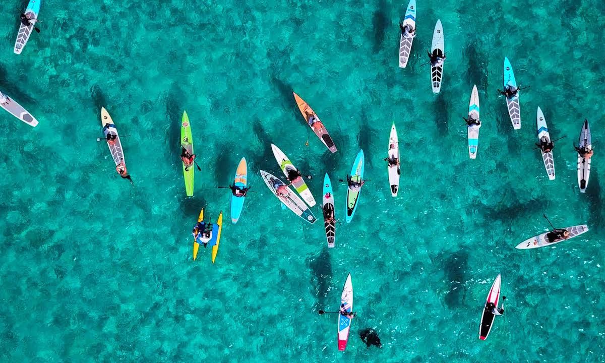 Paddlers assemble in Bimini, in preparation for the 80-mile Crossing For A Cure to Lake Worth Beach, Florida. Jimmy Buffett has signed on as an Advisor to the Board of Piper’s Angels Foundation. | Photo Courtesy: Crossing for a Cure