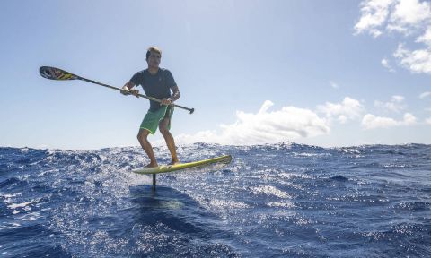 Kai Lenny SUP foiling through the Hawaiian Islands. | Photo: Red Bull