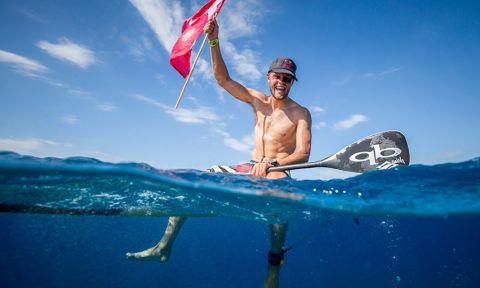 Casper Steinfath soaks in the joy of winning his third Gold Medal in the Men’s SUP Technical Race. | Photo: ISA / Ben Reed