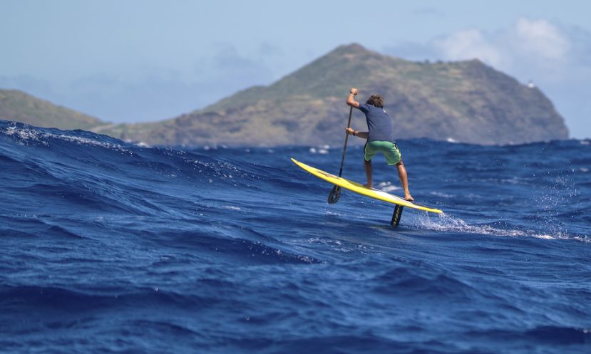 Kai Lenny stand up paddle foiling between Molokai and Oahu. | Photo Courtesy: Red Bull