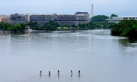 From left to right paddlers Jason Kopp, Maria Schultz, Matt Jones, Kathy Summers and Guillermo Loria begin their journey along the Georgetown Waterfront in DC. | Photo: Deb Stipa