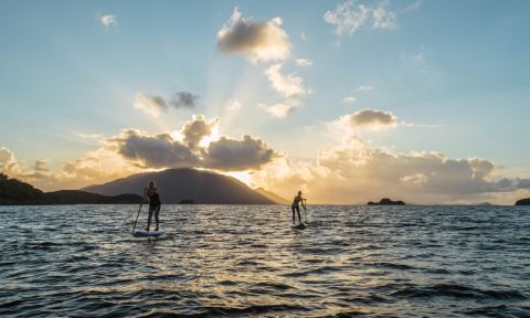 Nikki Gregg and friend paddling in New Caledonia during filming for a Facing Waves episode. | Photo Courtesy: Facing Waves