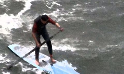 Matt Becker facing the challenging conditions in Santa Cruz, California at the Surftech Surf & Sand Duel-athlon.