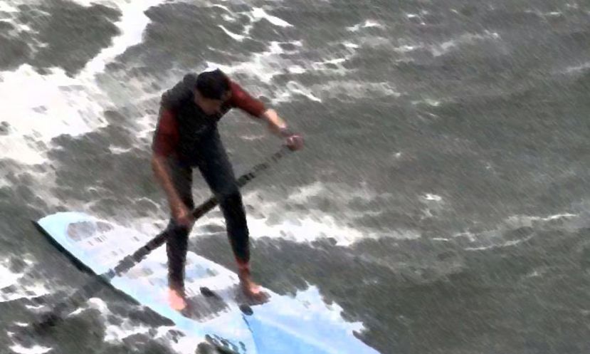 Matt Becker facing the challenging conditions in Santa Cruz, California at the Surftech Surf &amp; Sand Duel-athlon.