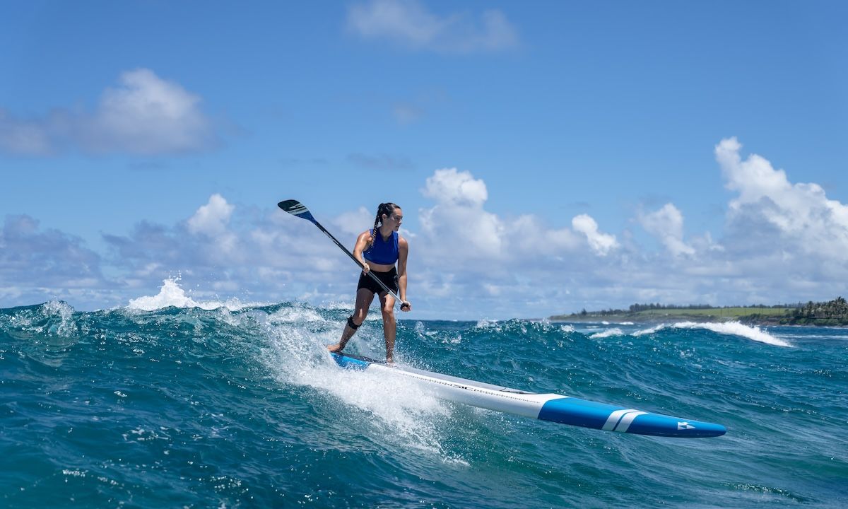 Jade Howson, a SIC Maui athlete, is seen riding the waves on Maui with their Bullet SUP.