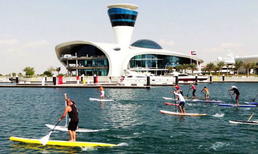 Stand up paddle board racers off the gates in the first stop of the Abu Dhabi SUP Race Series, United Arab Emirates.