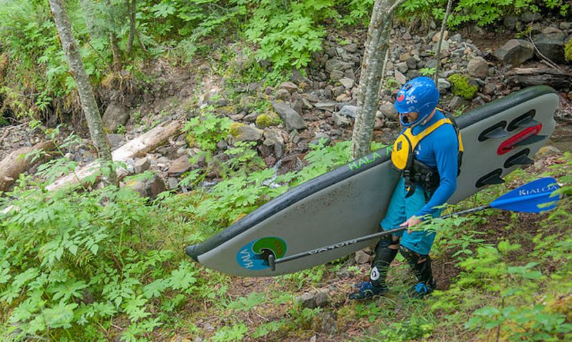 The outerwear of kayakers is the uniform of river paddle boarders. | Photo: Paul Clark